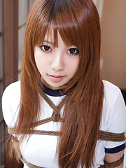 Dimdim Asian in long socks and sports outfit has hands tied