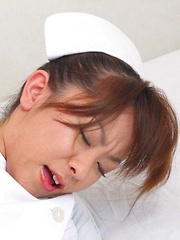 Japanese nurse Miina Minamoto alone and toying in a room